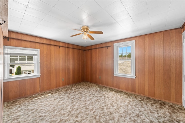 34 Tilden Ave, Warwick, RI 02888 - empty room with a ceiling fan, carpet flooring, and wooden walls