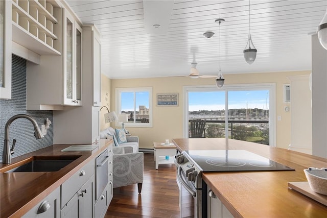 1503 Capella S Unit 1503, Newport, RI 02840 - kitchen featuring stainless steel electric range oven, plenty of natural light, dark wood-style flooring, and decorative backsplash