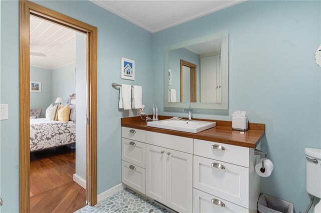 1503 Capella S Unit 1503, Newport, RI 02840 - bathroom with crown molding, vanity, wood finished floors, and ensuite bathroom