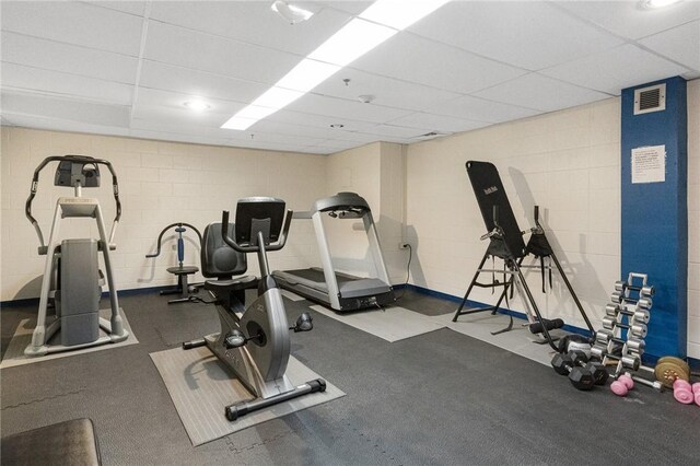 1503 Capella S Unit 1503, Newport, RI 02840 - gym featuring a paneled ceiling and concrete block wall
