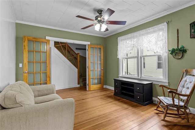 167 Carter Ave, Pawtucket, RI 02861 - sitting room with light wood-type flooring, stairway, ceiling fan, and ornamental molding