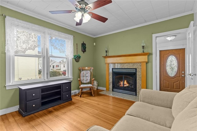 167 Carter Ave, Pawtucket, RI 02861 - living room with light wood-type flooring, a tile fireplace, crown molding, and a ceiling fan