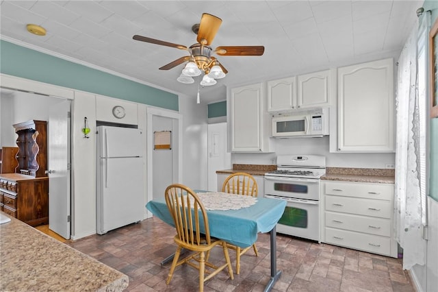 167 Carter Ave, Pawtucket, RI 02861 - kitchen with white appliances, white cabinetry, ceiling fan, brick patterned floors, and light countertops