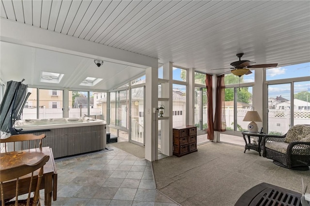 167 Carter Ave, Pawtucket, RI 02861 - sunroom / solarium featuring a wall of windows, healthy amount of natural light, a ceiling fan, a jacuzzi, and vaulted ceiling