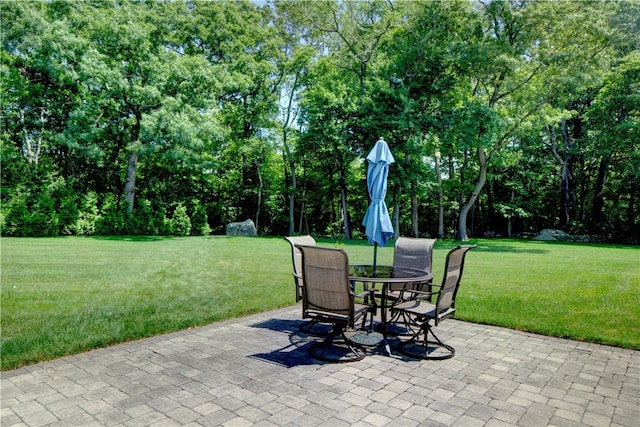 42 Aubin St, Seekonk, MA 02771 - view of patio featuring outdoor dining area and view of wooded area