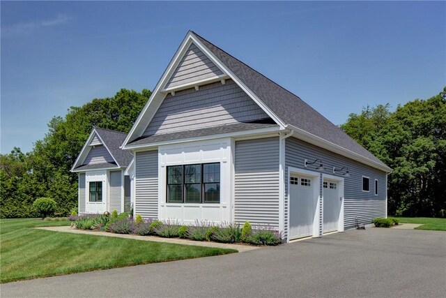 42 Aubin St, Seekonk, MA 02771 - view of front of house with a garage, a front yard, and roof with shingles