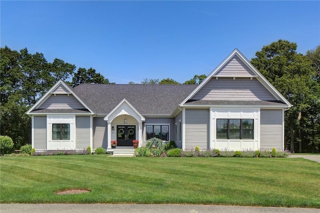 42 Aubin St, Seekonk, MA 02771 - view of front of home with a front lawn, french doors, and a shingled roof