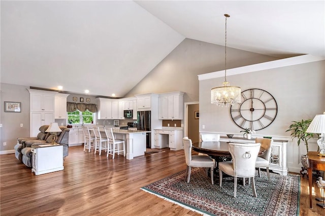 42 Aubin St, Seekonk, MA 02771 - dining room with a chandelier, high vaulted ceiling, and wood finished floors