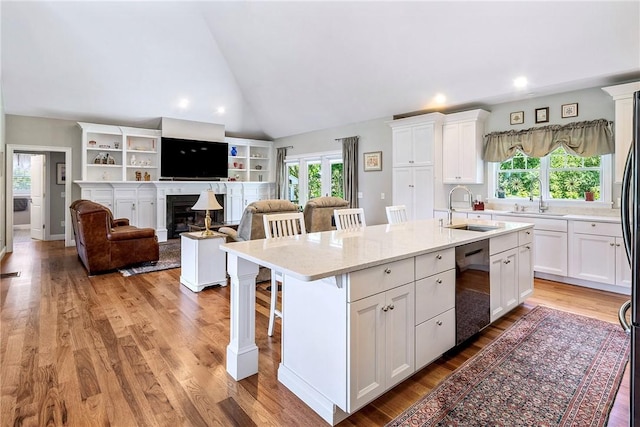 42 Aubin St, Seekonk, MA 02771 - kitchen featuring stainless steel dishwasher, white cabinets, healthy amount of natural light, recessed lighting, and high vaulted ceiling