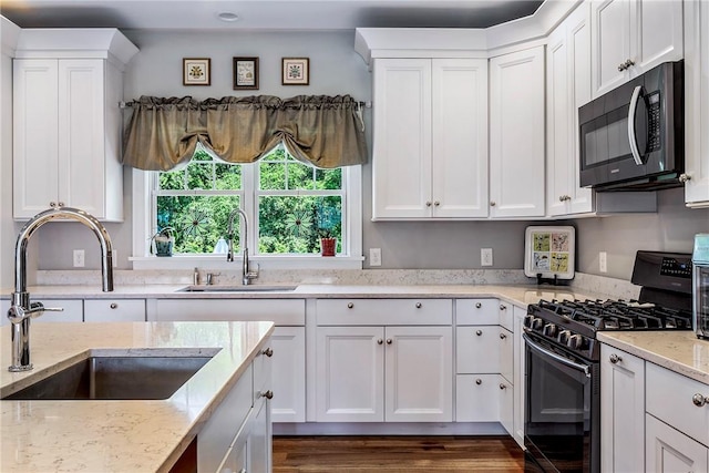 42 Aubin St, Seekonk, MA 02771 - kitchen featuring gas stove, white cabinetry, light stone counters, and dark wood-style floors