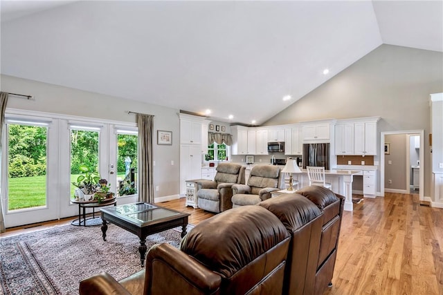 42 Aubin St, Seekonk, MA 02771 - living area featuring high vaulted ceiling, light wood-type flooring, recessed lighting, and french doors