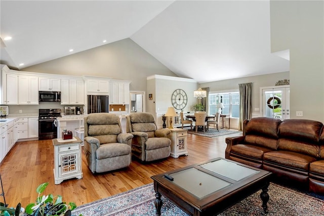 42 Aubin St, Seekonk, MA 02771 - living room featuring high vaulted ceiling, a chandelier, light wood-type flooring, and recessed lighting