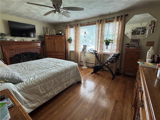 70 Partition St, Warwick, RI 02888 - bedroom with wood finished floors, a baseboard radiator, and a ceiling fan