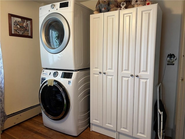 70 Partition St, Warwick, RI 02888 - washroom with stacked washer / dryer, cabinet space, baseboard heating, and dark wood-type flooring