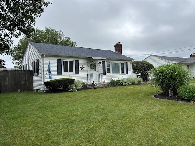 70 Partition St, Warwick, RI 02888 - view of front of property with a chimney and a shingled roof