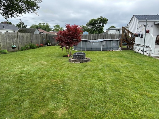 70 Partition St, Warwick, RI 02888 - fenced backyard with a fire pit and a deck
