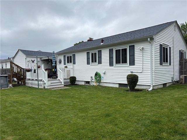 70 Partition St, Warwick, RI 02888 - back of house featuring a yard, a wooden deck, a chimney, and roof with shingles
