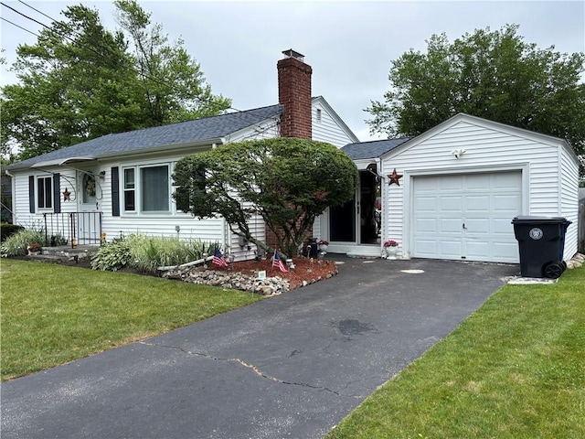 70 Partition St, Warwick, RI 02888 - ranch-style home featuring a chimney, a front lawn, driveway, an attached garage, and roof with shingles