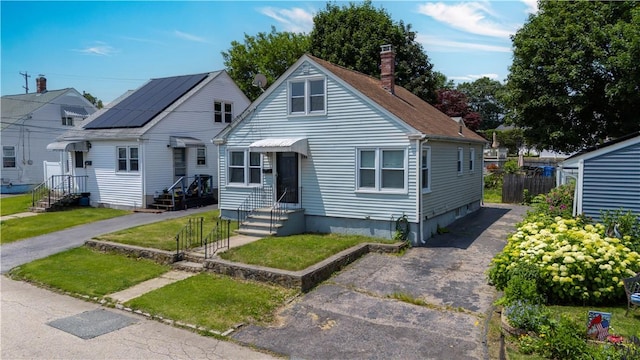 166 Midwood St, Cranston, RI 02910 - bungalow-style home with a chimney