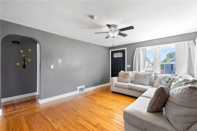 166 Midwood St, Cranston, RI 02910 - living area with ceiling fan, arched walkways, and light wood finished floors