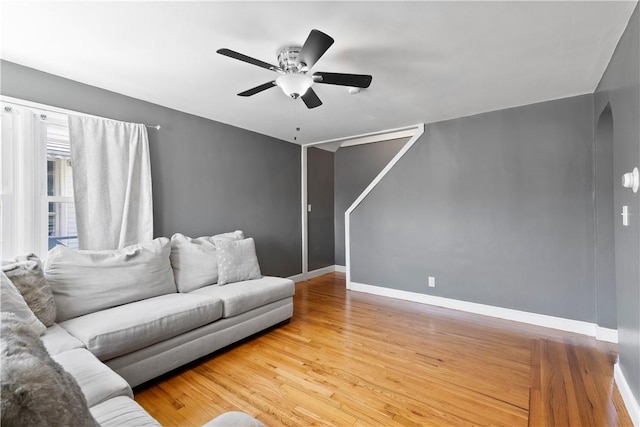 166 Midwood St, Cranston, RI 02910 - living area with arched walkways, wood finished floors, and ceiling fan
