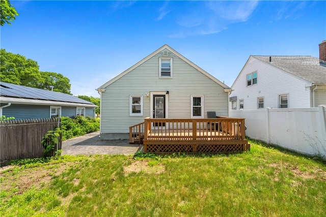 166 Midwood St, Cranston, RI 02910 - rear view of property featuring a fenced backyard and a deck