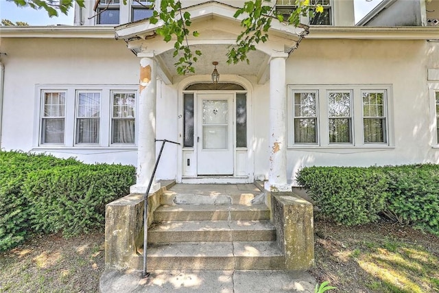 59 Colonial Ave, Cranston, RI 02910 - view of exterior entry featuring stucco siding