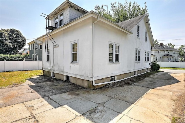 59 Colonial Ave, Cranston, RI 02910 - view of side of home with a patio area and stucco siding