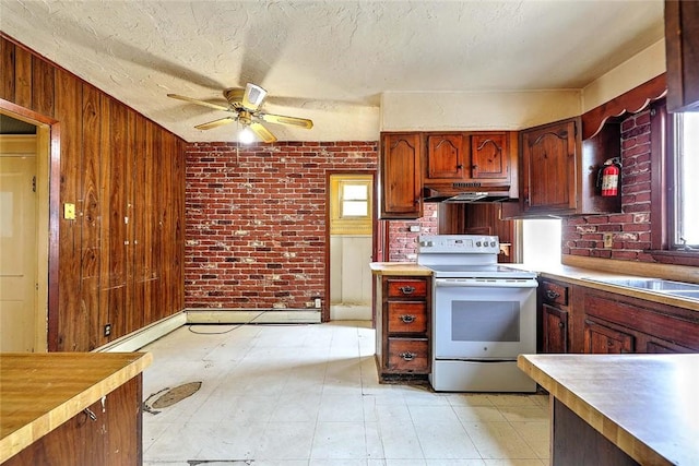 59 Colonial Ave, Cranston, RI 02910 - kitchen with electric stove, under cabinet range hood, ceiling fan, light countertops, and brick wall