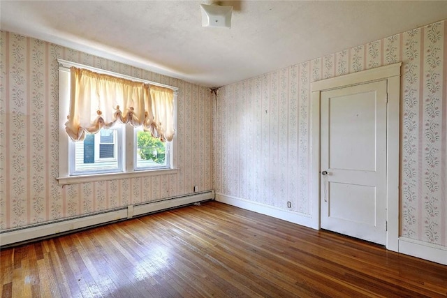 59 Colonial Ave, Cranston, RI 02910 - spare room with baseboard heating, hardwood / wood-style flooring, and wallpapered walls