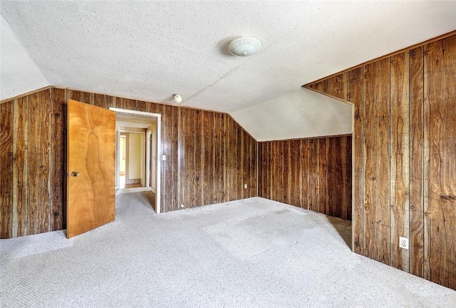 59 Colonial Ave, Cranston, RI 02910 - bonus room featuring wooden walls, vaulted ceiling, carpet flooring, and a textured ceiling
