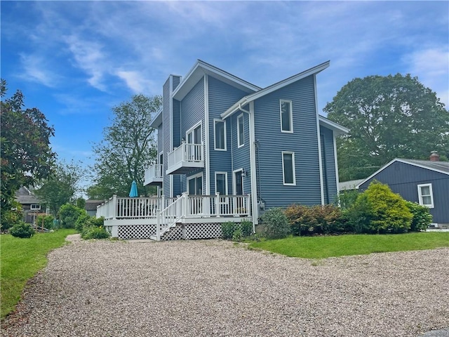 34 Beach Plum Rd, Narragansett, RI 02882 - view of side of home with a chimney and a wooden deck
