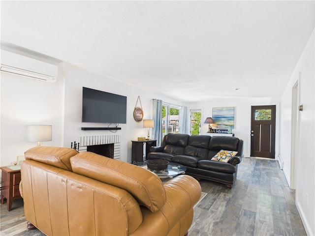 34 Beach Plum Rd, Narragansett, RI 02882 - living area featuring an AC wall unit, wood finished floors, and a fireplace