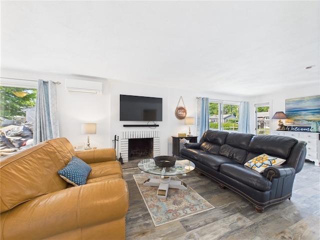34 Beach Plum Rd, Narragansett, RI 02882 - living area with plenty of natural light, wood finished floors, a wall unit AC, and a fireplace