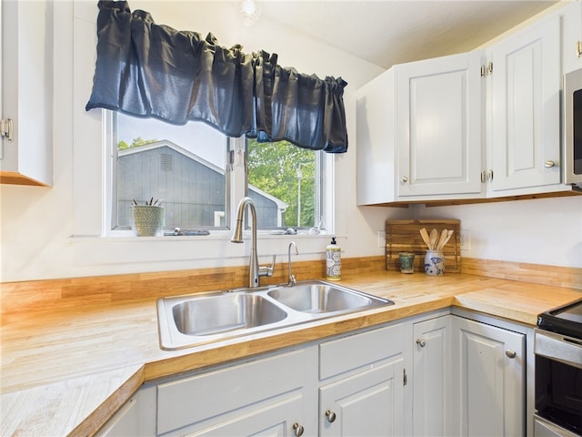 34 Beach Plum Rd, Narragansett, RI 02882 - kitchen featuring butcher block counters, white cabinets, electric stove, and stainless steel microwave