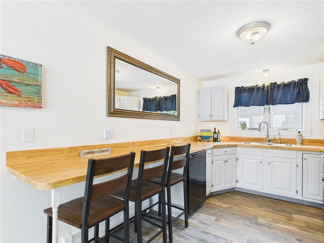 34 Beach Plum Rd, Narragansett, RI 02882 - kitchen with dishwasher, light wood-style floors, and white cabinets