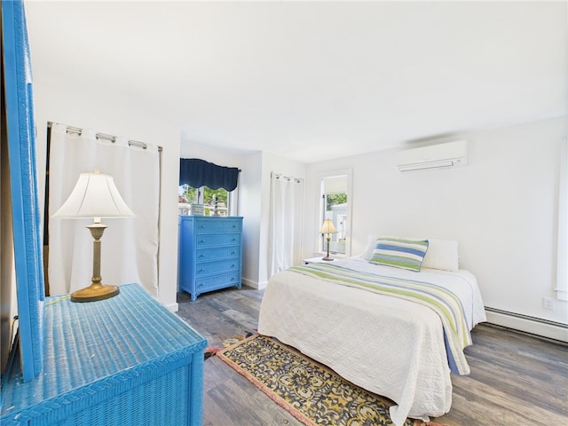 34 Beach Plum Rd, Narragansett, RI 02882 - bedroom with an AC wall unit, wood finished floors, and a baseboard radiator