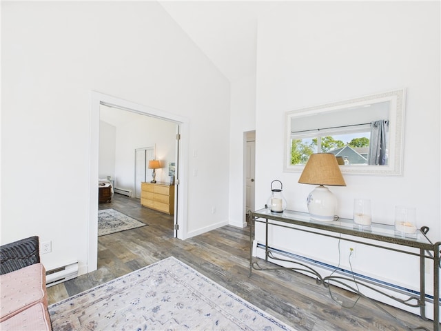 34 Beach Plum Rd, Narragansett, RI 02882 - corridor with baseboard heating, wood finished floors, and high vaulted ceiling