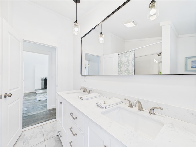 34 Beach Plum Rd, Narragansett, RI 02882 - bathroom with double vanity, marble look tile flooring, crown molding, and curtained shower