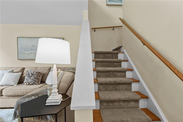 180 Fishing Cove Rd, North Kingstown, RI 02852 - staircase with wood finished floors and baseboards