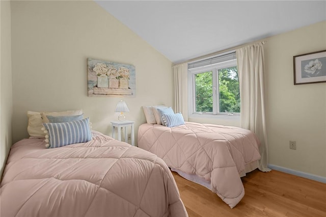 180 Fishing Cove Rd, North Kingstown, RI 02852 - bedroom with light wood-style flooring and vaulted ceiling