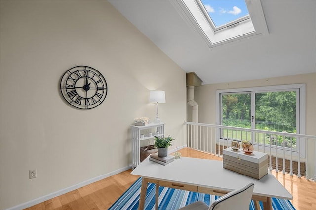 180 Fishing Cove Rd, North Kingstown, RI 02852 - dining area featuring wood finished floors, lofted ceiling, and a skylight
