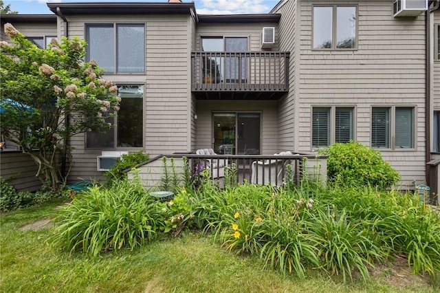 180 Fishing Cove Rd, North Kingstown, RI 02852 - rear view of house featuring a balcony and an AC wall unit