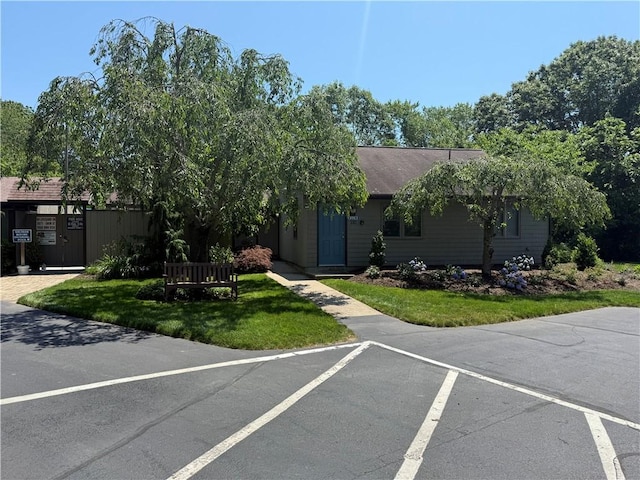 180 Fishing Cove Rd, North Kingstown, RI 02852 - view of front facade featuring a front lawn