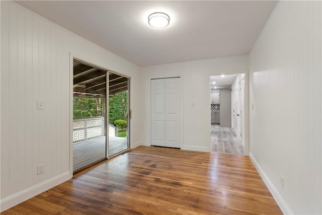 226 Quaker Ln, Scituate, RI 02857 - unfurnished room with wood finished floors and baseboards