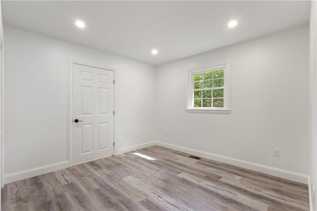 226 Quaker Ln, Scituate, RI 02857 - spare room with recessed lighting and wood finished floors