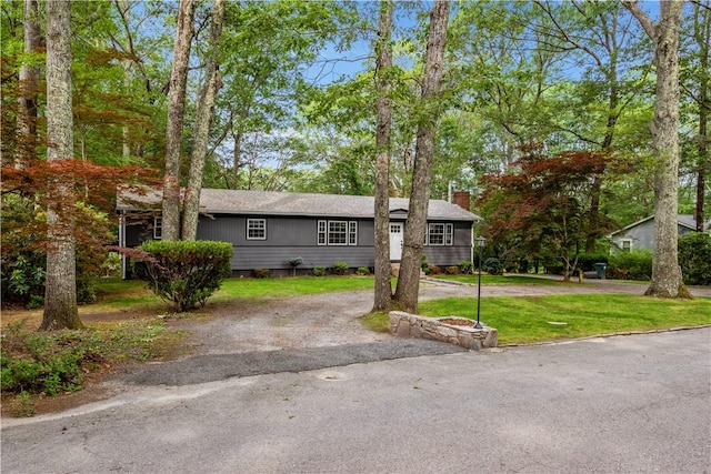 226 Quaker Ln, Scituate, RI 02857 - ranch-style house featuring a chimney, driveway, and a front lawn
