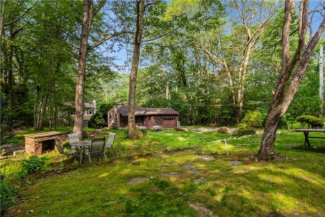 226 Quaker Ln, Scituate, RI 02857 - view of grassy yard featuring a garage and an outdoor structure
