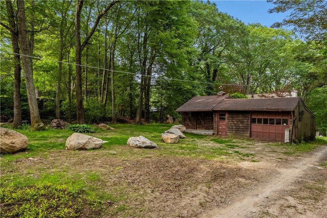 226 Quaker Ln, Scituate, RI 02857 - view of yard with a garage and dirt driveway