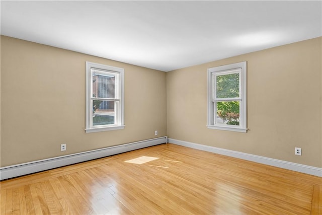 74 Park View Blvd, Cranston, RI 02910 - empty room with baseboard heating and wood finished floors